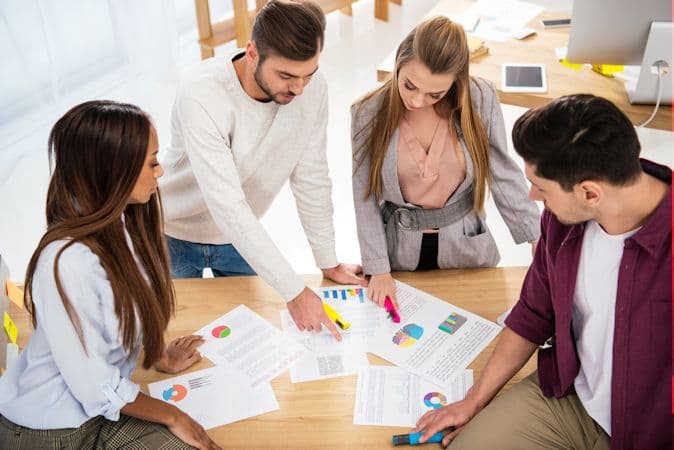 Employees analyzing servey data